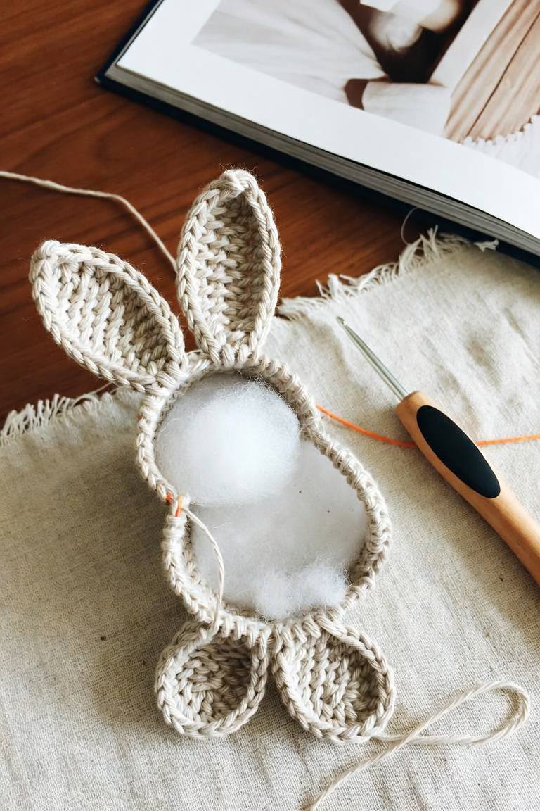 Crochet bunny body construction showing internal fiberfill stuffing and perimeter shaping